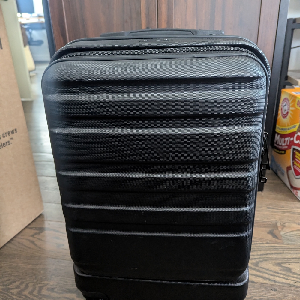 Calpak Black Hard Shell Carry On luggage